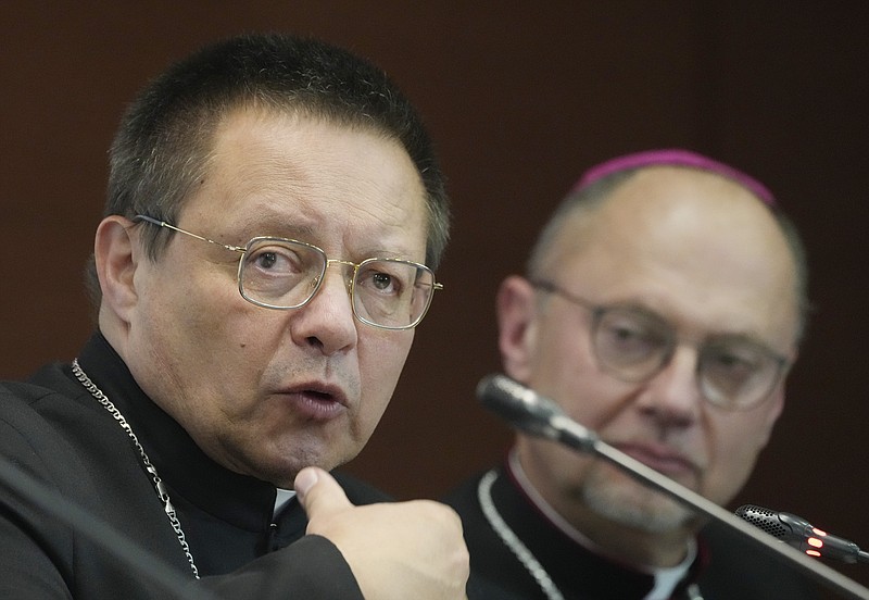 Poland's Archbishop Grzegorz Rys, left, meets the media on Tuesday, 14 March 2023. (AP Photo/Czarek Sokolowski)