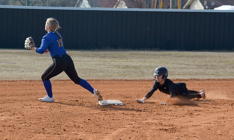 Graham Thomas/Herald-Leader
Siloam Springs leadoff batter Hannah Mather slides into second base with a double as Mountain Home's Mallorie Drewry awaits the throw during Game 1 of a 5A-West Conference doubleheader on March 14.