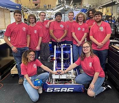 Arkansas High School’s robotics team won at the FIRST Robotics Regional Competition, earning the young engineers an invitation to the FIRST Robotics Global Championship. Pictured are, front row from left, Gabbie Boswell and Marlee Moore; back Row from left, Michael Forehand, Caleb Kisselburg, Luc Walz, Daniel Ruelas, Matthew Hughes, Gavin Nalepa, Brett Radford and Brennan Cross. (TASD)