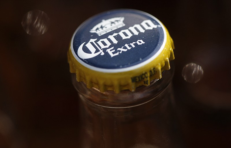 A Corona beer, a Constellation Brands Inc. product, is seen April 1, 2010, in Marysville, Pa. In a case that hinged on the definition of “beer,” a federal jury ruled Wednesday, March 15, 2023, that Constellation Brands can still sell Corona and Modelo hard seltzers in the U.S. (AP Photo/Carolyn Kaster, File)