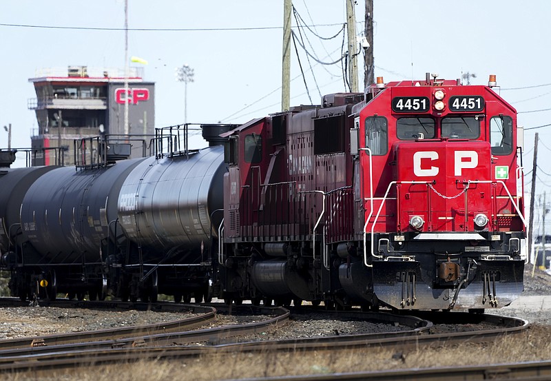 Canadian Pacific trains sit idle on the tracks due to a strike at the main CP Rail train yard March 21, 2022, in Toronto. The first major railroad merger since the 1990s was approved Wednesday, March 15, 2023, when federal regulators gave approval to Canadian Pacific's $31 billion acquisition of Kansas City Southern railroad. (Nathan Denette/The Canadian Press via AP)