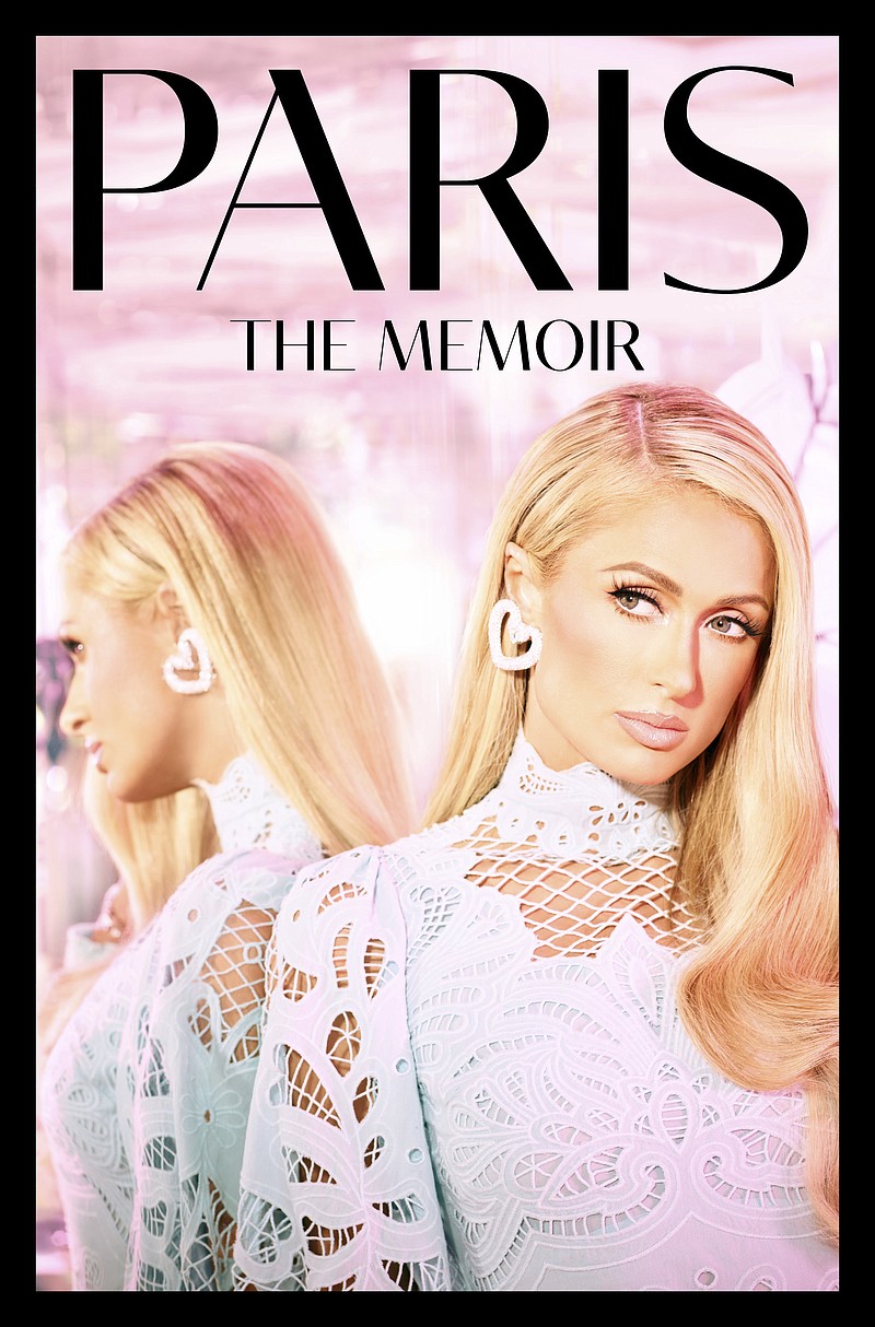 This cover image released by Dey Street shows "Paris: The Memoir" by Paris Hilton. (Dey Street via AP)