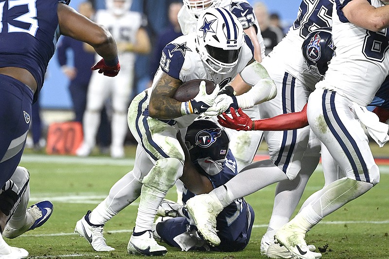 Dallas Cowboys running back Ezekiel Elliott (21) runs into the end zone for a touchdown against the Tennessee Titans during the first half of an NFL football game, Thursday, Dec. 29, 2022, in Nashville, Tenn. (AP Photo/Mark Zaleski)