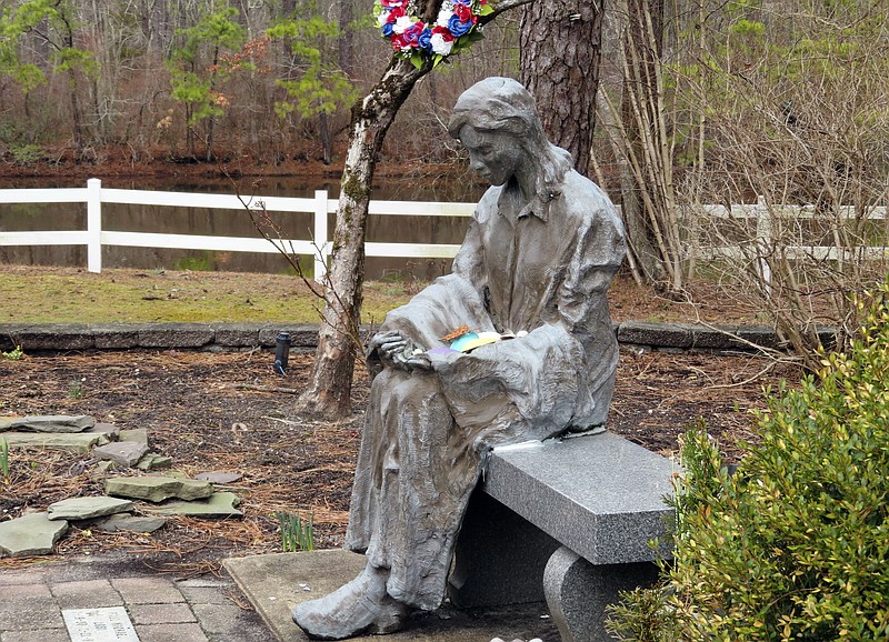 A sculpture of a grieving mother is seen Feb. 21 at a memorial garden in Toms River, N.J. for children who died from any cause. (AP/Wayne Parry)