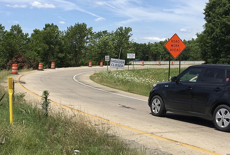 FILE - A motorist prepares to enter a construction area on Interstate 440 in North Little Rock, Ark., June 7, 2017. A half-cent sales tax for highways that voters approved in 2020 is not limited to funding four-lane roads, the Arkansas Supreme Court ruled Thursday, March 16, 2023, clearing the way for the tax to help fund an interstate project in the downtown Little Rock area. (AP Photo/Kelly P. Kissel, File)