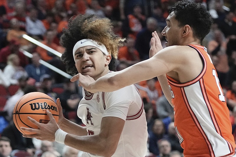 Arkansas's Anthony Black is fouled by Illinois's RJ Melendez during the second half of a first-round college basketball game in the NCAA Tournament Thursday, March 16, 2023, in Des Moines, Iowa. (AP Photo/Morry Gash)