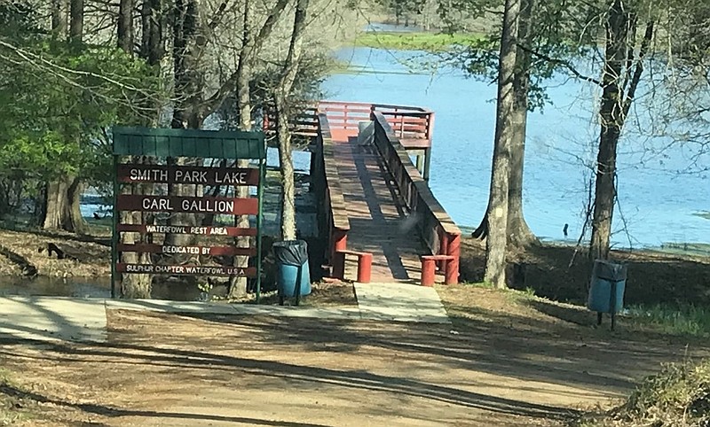 A pier stretches into the fishing pond at Smith Park in rural Miller County. The 320-acre park, which features 14 natural springs, recently received $78,336 from the Arkansas Office of Outdoor Recreation for continued improvements. (Staff photo by Greg Bischof)