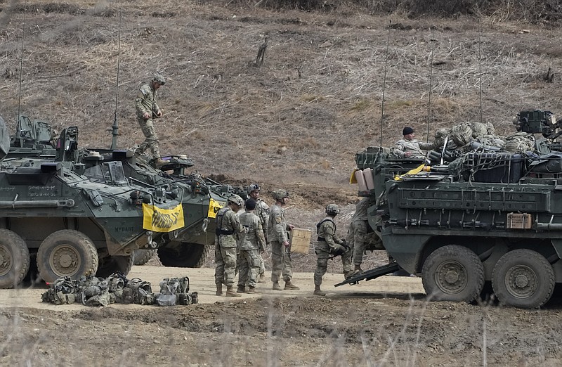 U.S. Army soldiers prepare for their exercise at a training field in Paju, South Korea, near the border with North Korea, Friday, March 17, 2023. North Korea said Friday it fired an intercontinental ballistic missile to "strike fear into the enemies" as South Korea and Japan agreed at a summit to work closely on regional security with the United States and staged military exercises around the region.(AP Photo/Ahn Young-joon)