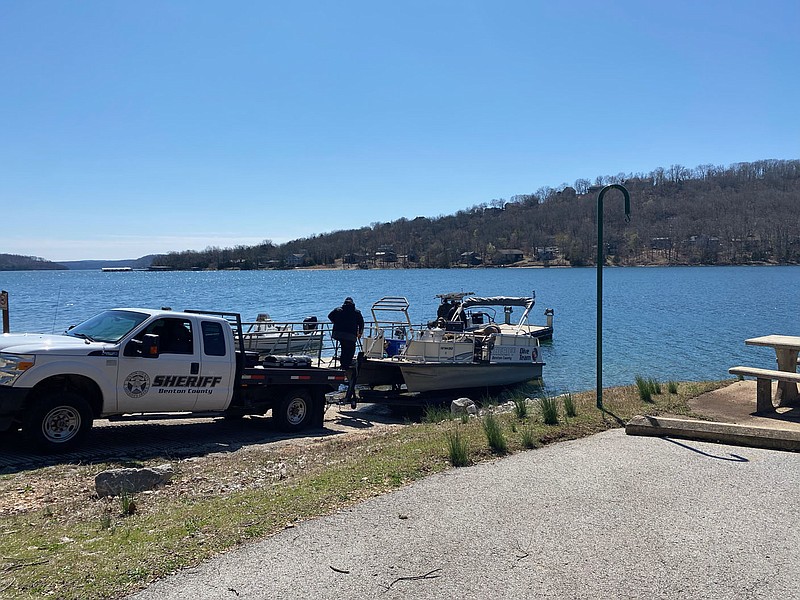 The Benton County Sheriff’s Office drops a boat into the water at Beaver Lake on Friday as it conducts a search for two kayakers who went missing a day earlier.

(NWA Democrat-Gazette/Tracy Neal)