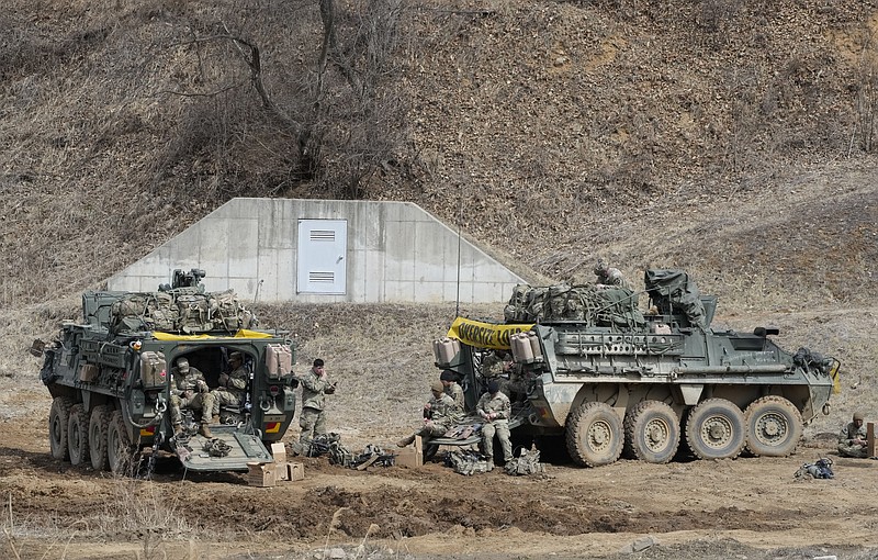 U.S. Army soldiers prepare for their exercise at a training field in Paju, South Korea, near the border with North Korea, Friday, March 17, 2023. North Korea said Friday it fired an intercontinental ballistic missile to &quot;strike fear into the enemies&quot; as South Korea and Japan agreed at a summit to work closely on regional security with the United States and staged military exercises around the region.(AP Photo/Ahn Young-joon)