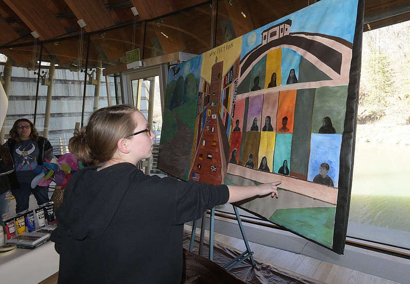 Myia Cunningham, a Helen Tyson Middle School student, talks Saturday March 18 2023 about her role in painting the mural. Go to nwaonline.com/photos for today's photo gallery.
(NWA Democrat-Gazette/Flip Putthoff)