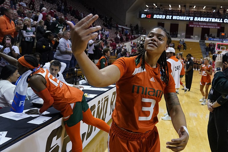 Miami's Destiny Harden celebrates with fans after Miami defeated Oklahoma State in a first-round college basketball game in the women's NCAA Tournament Saturday, March 18, 2023, in Bloomington, Ind. (AP Photo/Darron Cummings)