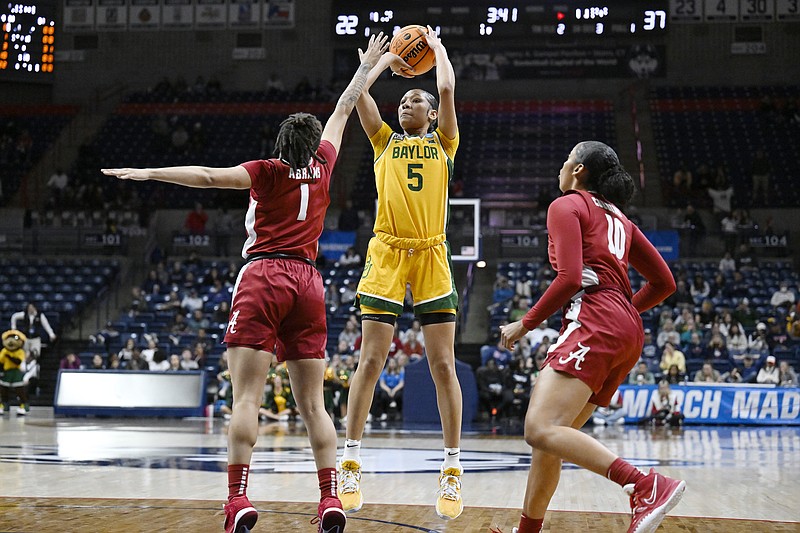 Baylor's Darianna Littlepage-Buggs (5) shoots over Alabama's Megan Abrams (1) in the first half of a first-round college basketball game in the NCAA Tournament, Saturday, March 18, 2023, in Storrs, Conn. (AP Photo/Jessica Hill)