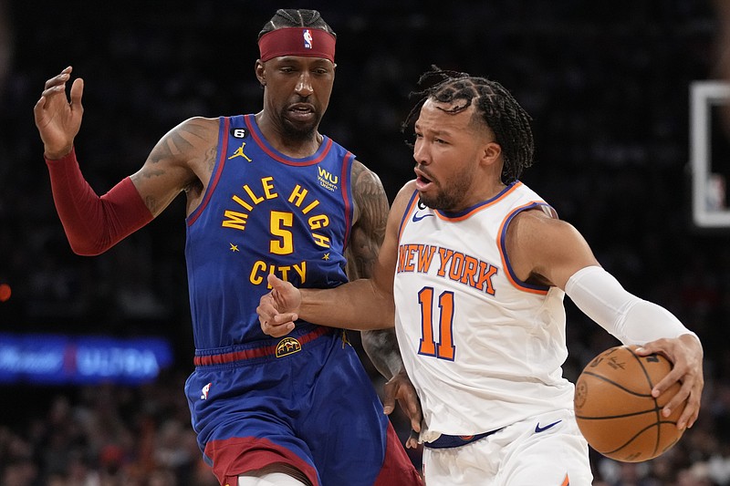 New York Knicks guard Jalen Brunson (11) drives against Denver Nuggets guard Kentavious Caldwell-Pope (5) during the second half of an NBA basketball game, Saturday, March 18, 2023, at Madison Square Garden in New York. The Knicks won 116-110. (AP Photo/Mary Altaffer)