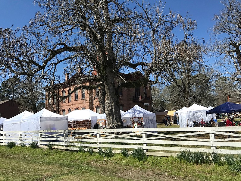 Vendors from the Four States Area are seen on the lawn of the 1874 Hempstead County Courthouse on the last day of the 55th annual Jonquil Festival on Sunday, March 19, 2023, in Washington, Ark. The festival has been held at the same location since 1968. (Staff photo by Greg Bischof)