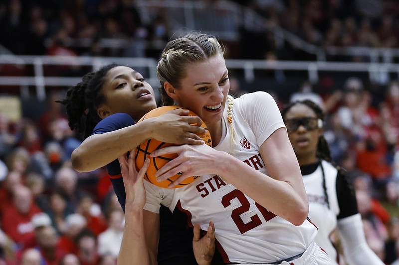 Mississippi guard Angel Baker, left, and Stanford forward Cameron Brink, right, vie for the ball during the first half of a second-round college basketball game in the women's NCAA Tournament, Sunday, March 19, 2023, in Stanford, Calif. (AP Photo/Josie Lepe)