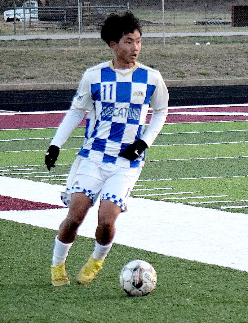 Mike Eckels/Special to the Eagle Observer
Bulldog Robert “T” Thang looks to pass to a teammate after he picked up the ball near the sideline during the March 13 Lincoln-Decatur soccer match in Lincoln. The Bulldogs and Wolves fought hard during the entire 80-minute contest but only managed one point each for a 1-1 tie.