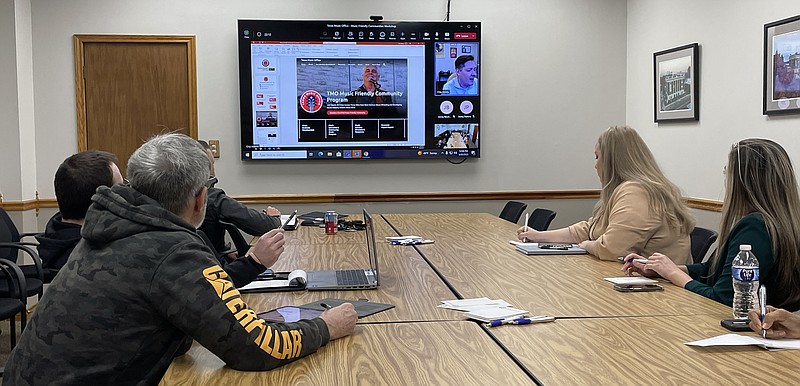 Interested residents watch a remote presentation by Chip Adams, Texas Music Office community relations and outreach specialist, Monday, March 20, 2023, at City Hall in Texarkana, Texas. The workshop meeting was the first step toward the city becoming certified as a Music Friendly Texas Community by the TMO. (Staff photo by Karl Richter)