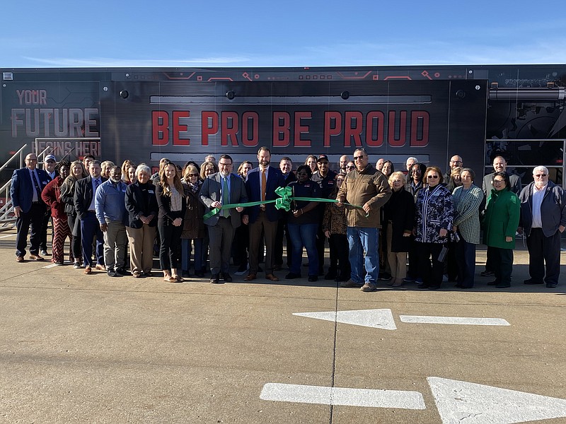 Anakin Bush/Fulton Sun
A crowd of local business leaders and community leaders stand in front of the Be Pro Be Proud simulation trailer for a ribbon cutting on Monday. Be Pro Be Proud will travel to high schools across Callaway County this week.