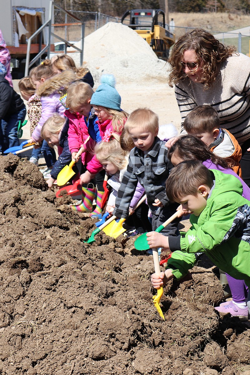 Anna Campbell/News Tribune photo: 
Cole R-5 preschool students participate Monday, March 20, 2023, in the groundbreaking of the expansion and construction of the Eagles Nest Preschool Center. As the children lined up for a picture, they were itching to dig into the dirt, and after Superintendent Charley Burch concluded his remarks, they were able to do just that.