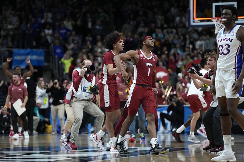 Arkansas guard Ricky Council IV (1) celebrates at the end of a second-round college basketball game against Kansas in the NCAA Tournament, Saturday, March 18, 2023, in Des Moines, Iowa. (AP Photo/Charlie Neibergall)