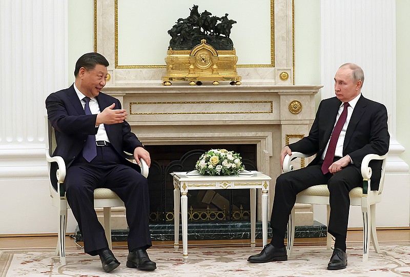 Chinese President Xi Jinping gestures as he speaks to Russian President Vladimir Putin during their meeting at the Kremlin in Moscow, Russia, Monday, March 20, 2023. (Sergei Karpukhin, Sputnik, Kremlin Pool Photo via AP)