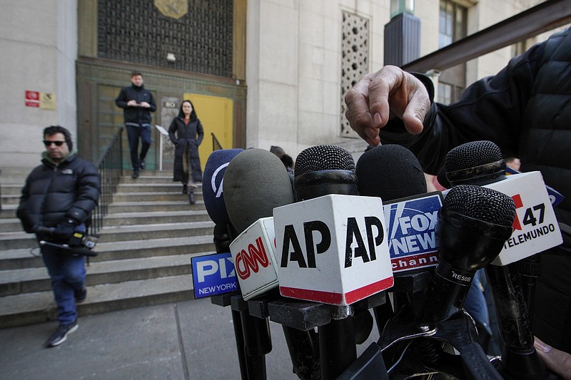 Media set up microphones in front of the courthouse ahead of former President Donald Trump's anticipated indictment on Monday, March 20, 2023, in New York. (AP Photo/Eduardo Munoz Alvarez)