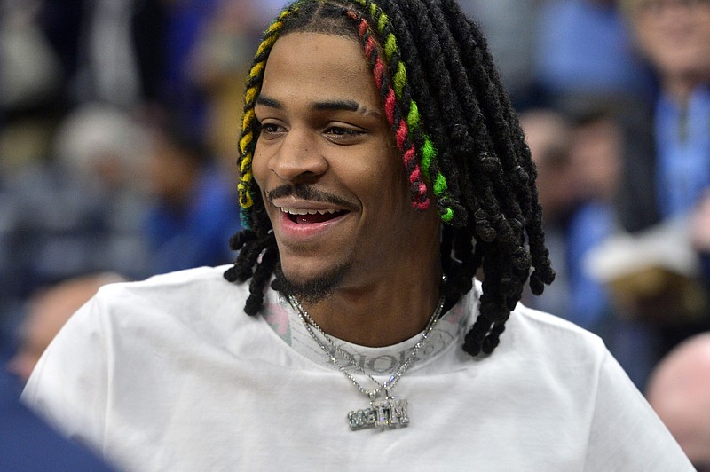 Memphis Grizzlies guard Ja Morant stands on the sideline before an NBA basketball game against the Dallas Mavericks, Monday, March 20, 2023, in Memphis, Tenn. (AP Photo/Brandon Dill)