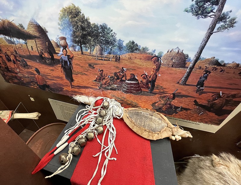 This imaginative painting of a Caddo Indian village rewards close attention. The more one looks at it, the more one understands something about life and history. (Photo by Neil Abeles)