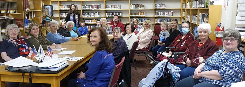 Daughters of the Republic of  Texas (DRT), James Bowie chapter, are seated in the second floor room of the Atlanta Public Library which also houses the Cass County Genealogical Society. The visit was led by Kathy Peacock of Atlanta, sponsor of the James Bowie chapter of the Children of the Republic of Texas. (Photo by Neil Abeles)