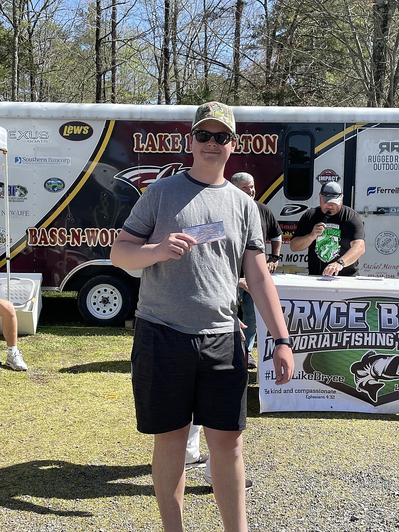 Youth Big Bass winner Canaan Hunter celebrates his weigh-in of 2.68 pounds at the Live Like Bryce Memorial Fishing Tournament at Crystal Springs on Lake Ouachita on April 23, 2022. - Submitted photo