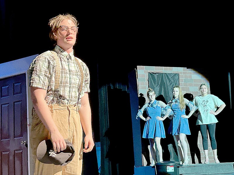 Lynn Kutter/Enterprise-Leader
Nathaniel Black, playing the main character Seymour in "Little Shop of Horrors," sings a song with his backup cast members in the background. Black is a senior at Farmington High School and has been involved in other productions at the school.