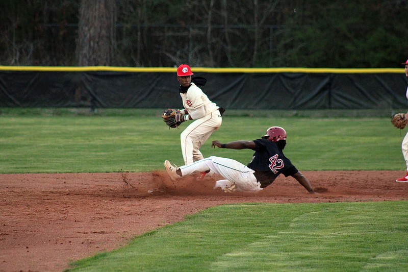 Photo By: Michael Hanich
Camden Fairview shortstop Martavius Thomas making a double-play in the game against Hope.
