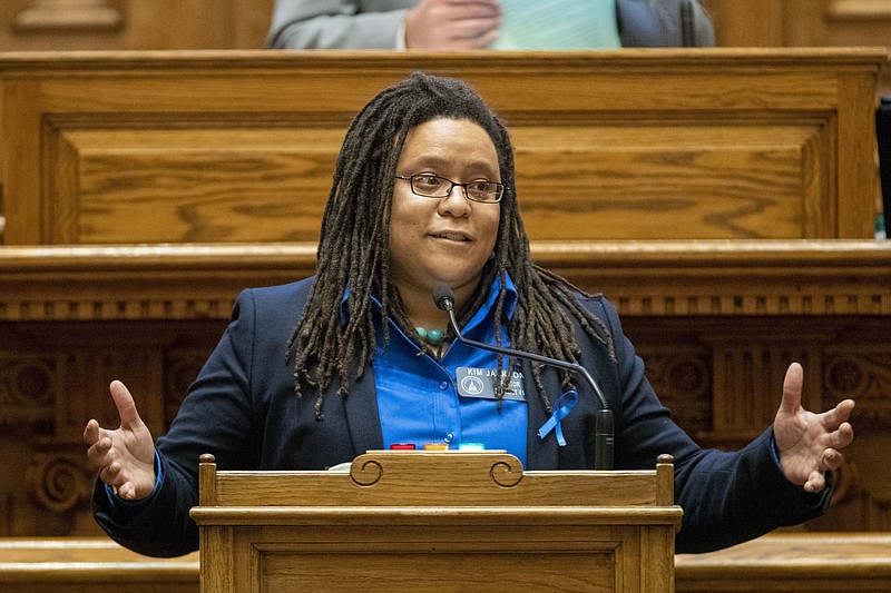 FILE - Sen. Kim Jackson speaks in opposition of a bill in the Senate Chambers during the legislative session at the Georgia State Capitol building in Atlanta on Feb. 23, 2021. A bill banning most gender-affirming surgeries and hormone replacement therapies in Georgia for transgender people under 18 is headed to Gov. Brian Kemp's desk after senators gave it final passage on Tuesday, March 21, 2023. Jackson, the Senate's first-ever openly gay member, says the bill attacks vulnerable children and intrudes on private medical decisions. (Alyssa Pointer/Atlanta Journal-Constitution via AP, File)
