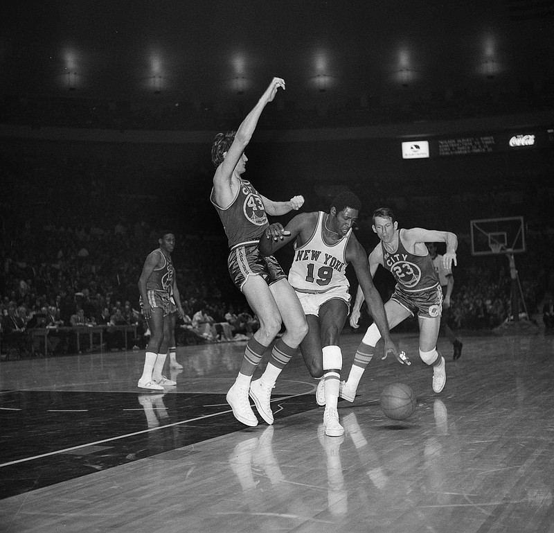 New York Knicks' Willis Reed (19) drives against San Francisco Warrior Clyde Lee (43) during a game at Madison Square Garden in New York on March 4, 1970. - Photo by John Lent of The Associated Press