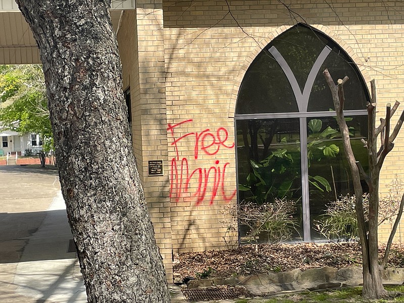 Mary’s Episcopal Church on Champagnolle Road over the weekend, spray-painting offensive religious imagery on the front door of the church and words on a wall on the west side of the building. (Matt Hutcheson/News-Times)