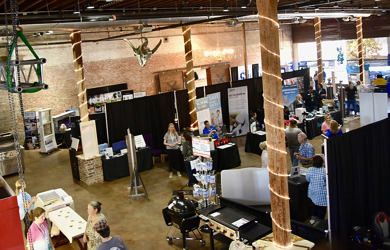 Visitors cruise the various booths during the Home & Garden Show on March 26, 2022, at Crossties Event Venue in downtown Texarkana, Ark. The