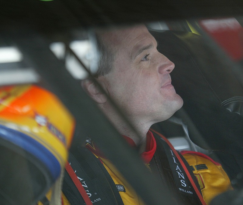 Kenny Wallace, driver of the No. 23 Dodge Winston Cup car, waits for the track to open for practice March 29, 2003, at Texas Motor Speedway.
(Democrat-Gazette file photo/Staton Breidenthal)
