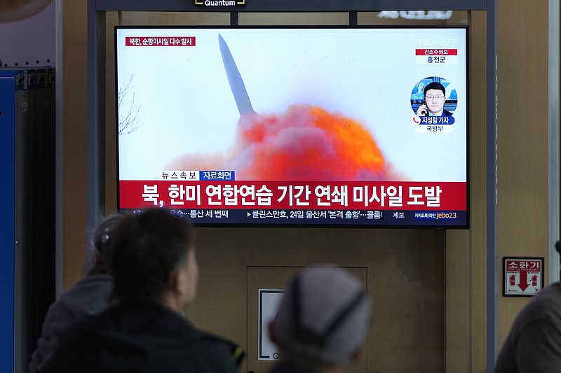 A TV screen reports about North Korea's missile launch with file image during a news program at the Seoul Railway Station in Seoul, South Korea, Wednesday, March 22, 2023. North Korea launched multiple cruise missiles toward the sea on Wednesday, South Korea's military said, three days after the North carried out what it called a simulated nuclear attack on South Korea. The letters read "North, launched multiple cruise missiles." (AP Photo/Lee Jin-man)