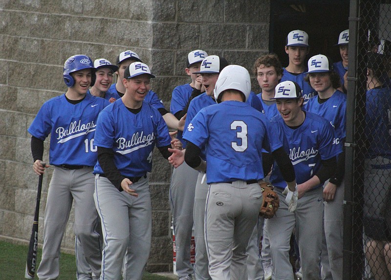 The South Callaway team cheer on Braden Allen after he hit a home run against North Callaway Wednesday at South Callaway's baseball field in Mokane. (Mexico Ledger/Jeremy Jacob)