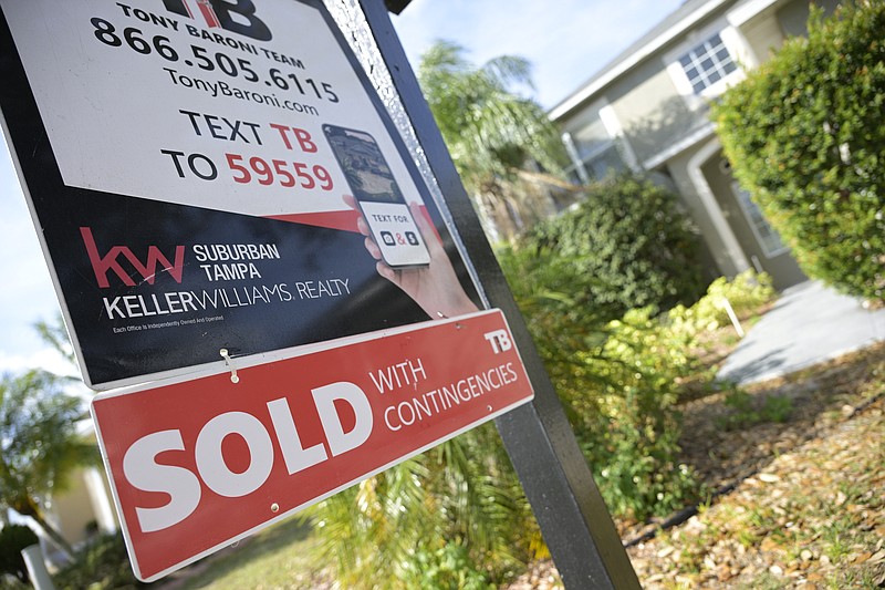 A real estate sign stands outside of a recently sold home Feb. 21, 2023, in Valrico, Fla. Americans eager to buy a home this spring, beware: It’s slim pickings out there. The number of U.S. homes on the market is at near-historic lows, which could dim would-be buyers’ prospects for finding a house or condo and fuel competition for the most affordable properties, economists say. (AP Photo/Phelan M. Ebenhack, File)