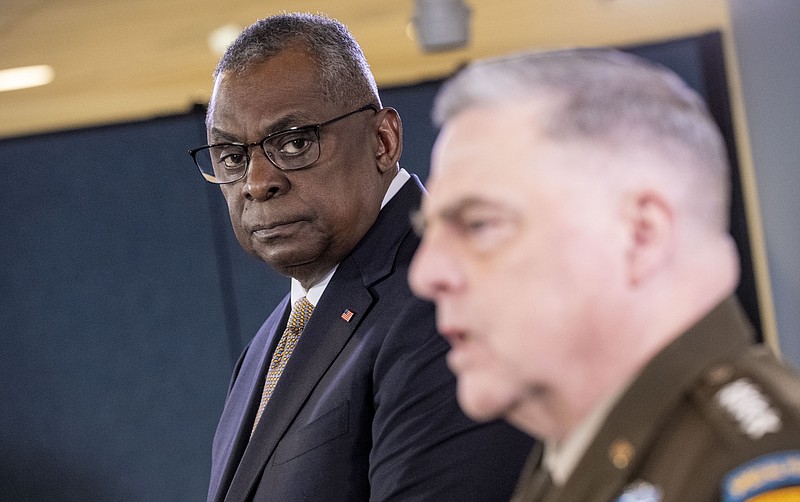 Chairman of the Joint Chiefs, Gen. Mark Milley, right, accompanied by Secretary of Defense Lloyd Austin, speaks during a briefing at the Pentagon in Washington, Wednesday, March 15, 2023. (AP Photo/Andrew Harnik)