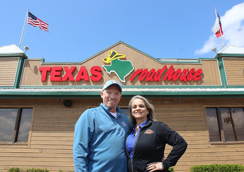 Managing partners Jeremy and Kerry Nienkamp stand outside Texas Roadhouse on Thursday afternoon, March 23, 2023, in Texarkana, Texas. Texas Roadhouse is moving to a new location at Summer Ridge and Mall Drive along Interstate 30. Groundbreaking at the site is scheduled for September 2023, with plans to open the restaurant by spring 2024. (Staff photo by Stevon Gamble)