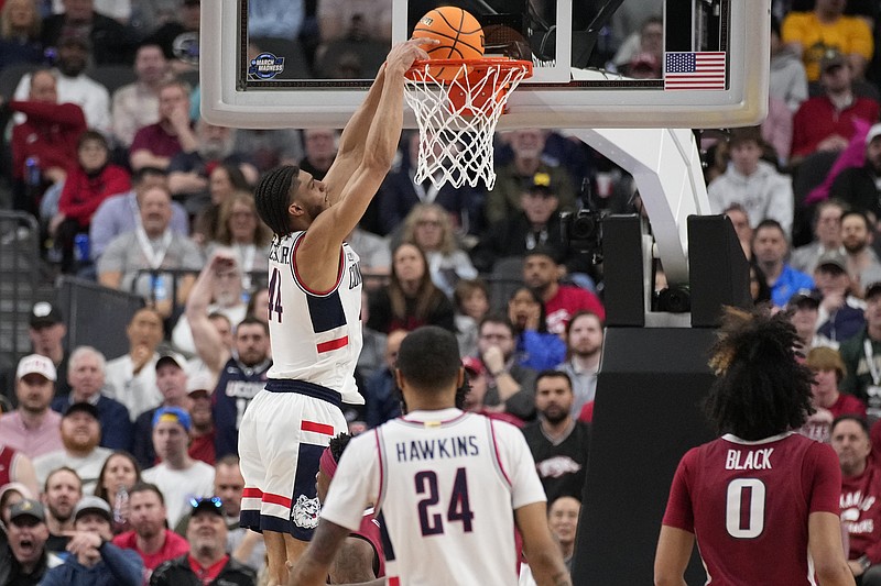 UConn's Andre Jackson Jr. dunks in the first half of a Sweet 16 college basketball game against against Arkansas in the West Regional of the NCAA Tournament, Thursday, March 23, 2023, in Las Vegas. (AP Photo/John Locher)