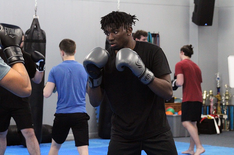 Photo By: Michael Hanich
Trey Frazier participating in kickboxing drills at TRIBE Gym.