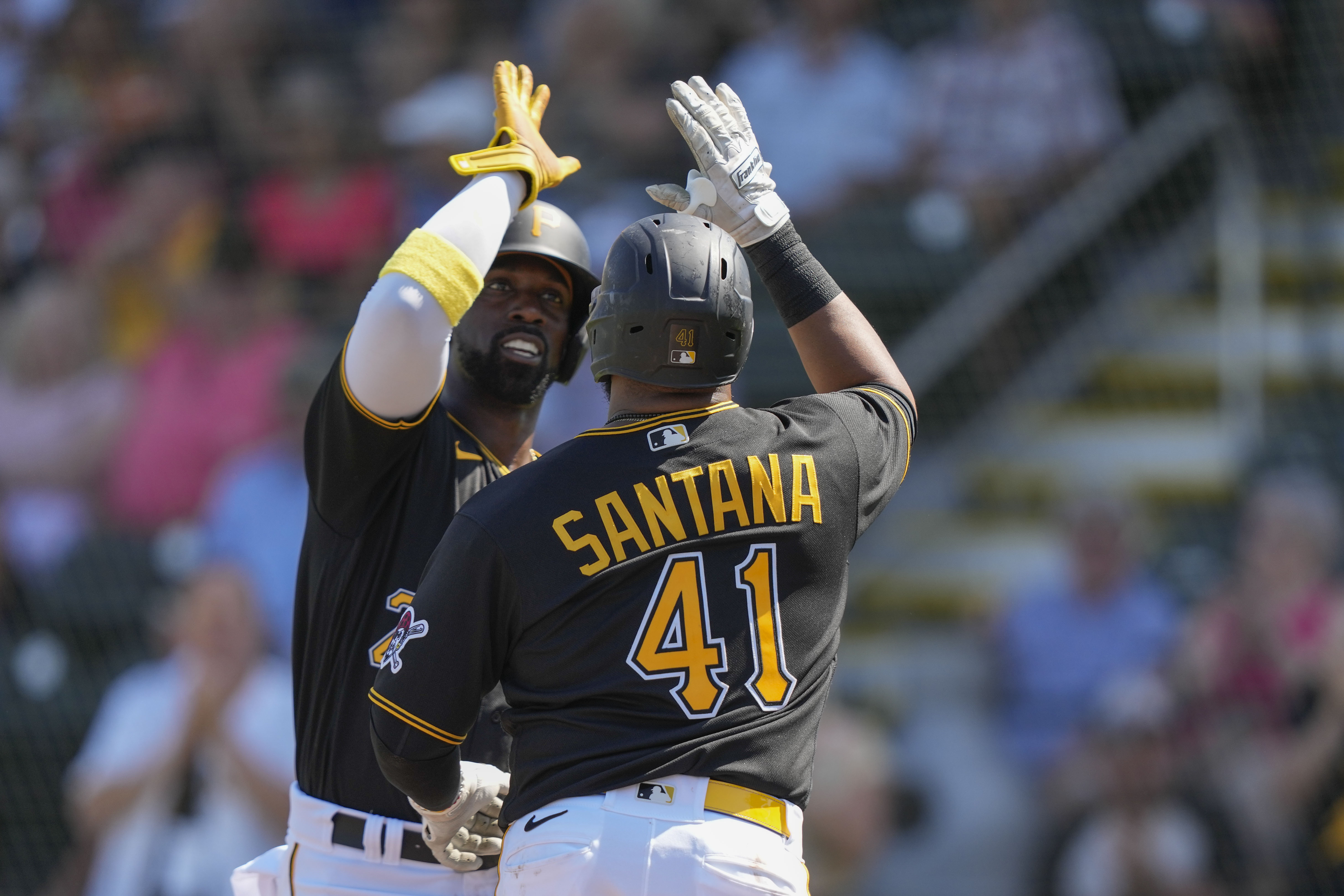 Pittsburgh Pirates left field Ji Hwan Bae, right, drops a fly ball by St.  Louis Cardinals' Paul Goldschmidt as Pirates shortstop Oneil Cruz, left,  watches during the first inning of a baseball