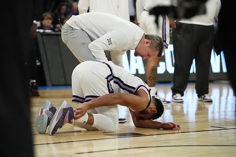 Kansas State guard Markquis Nowell (1) holds his ankle after a play in the Sweet 16 against Michigan State in the East Regional of the NCAA Tournament at Madison Square Garden Thursday in New York. - Photo by Frank Franklin II of The Associated Press