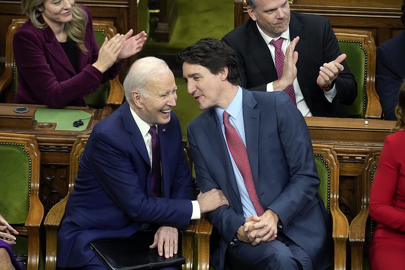 The Associated Press
Canadian Prime Minister Justin Trudeau talks with President Joe Biden before Biden speaks to the Canadian Parliament on Friday in Ottawa, Canada.