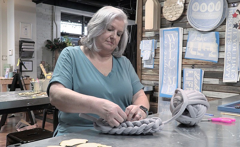 Cynthia Hall hand crochets a handbag from her DIY workshop Hammer and Stain Hot Springs. – Photo by Courtney Edwards of The Sentinel-Record