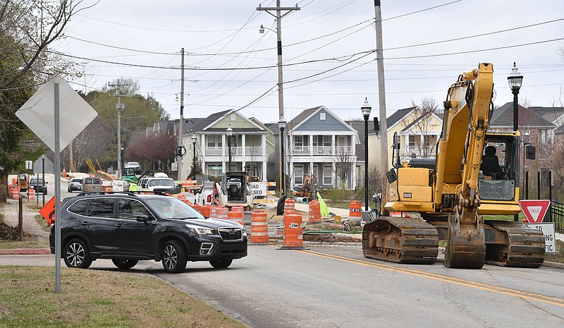 Traffic moves Wednesday, March 22, 2023, on Zion Road as construction continues in Fayetteville. The original estimated completion date for the project was February 2022. City officials say extensive sewer line work, labor and materials shortages related to the pandemic, changes in design and inclement weather have delayed the project. Visit nwaonline.com/photo for today's photo gallery. 
(NWA Democrat-Gazette/Andy Shupe)